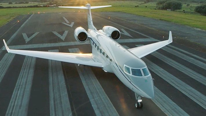 A Gulfstream jet on the runway.